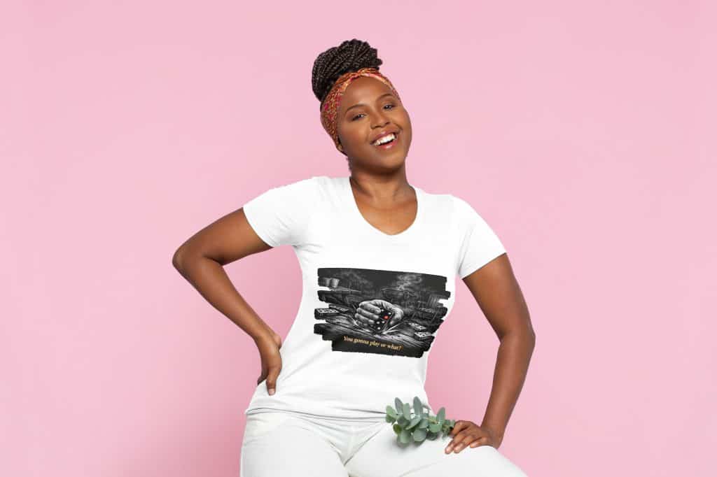 Woman wearing Cousins Dozens themed T-shirt with a pink background.