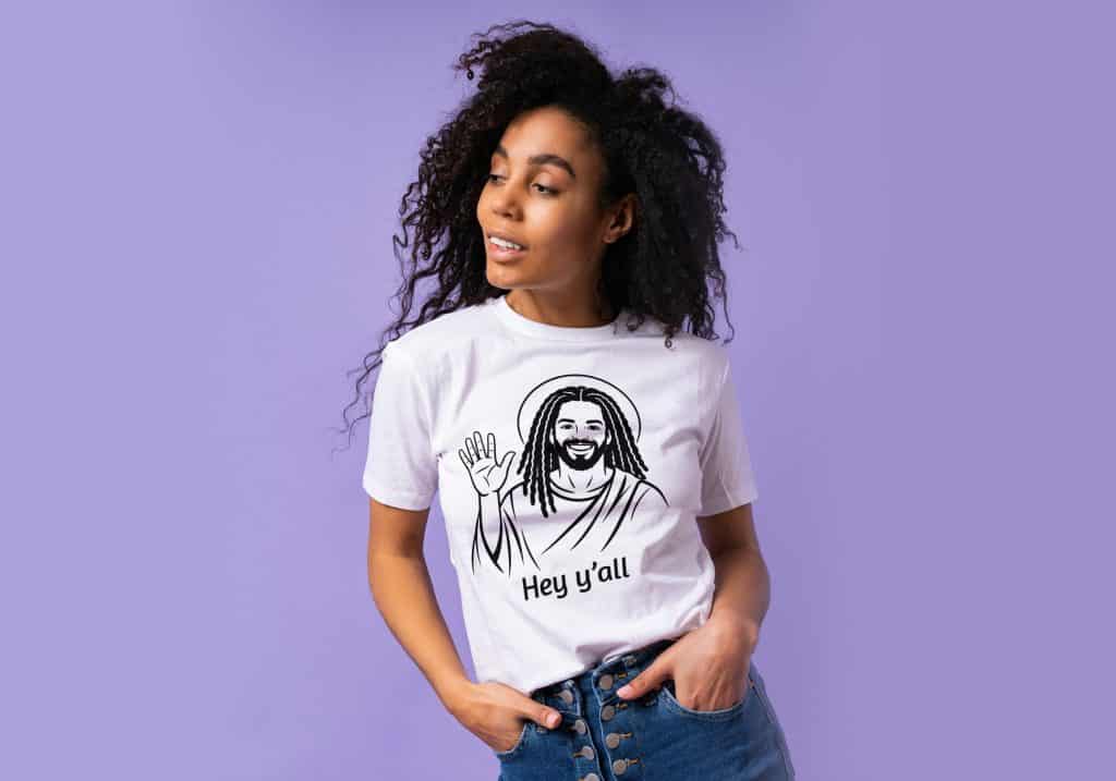 Woman wearing Cousins Dozens T-shirt with dreadlocks illustration, casual style.