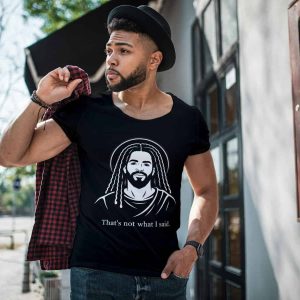 Young man wearing Cousins Dozens T-shirt with Jesus graphic outdoors.