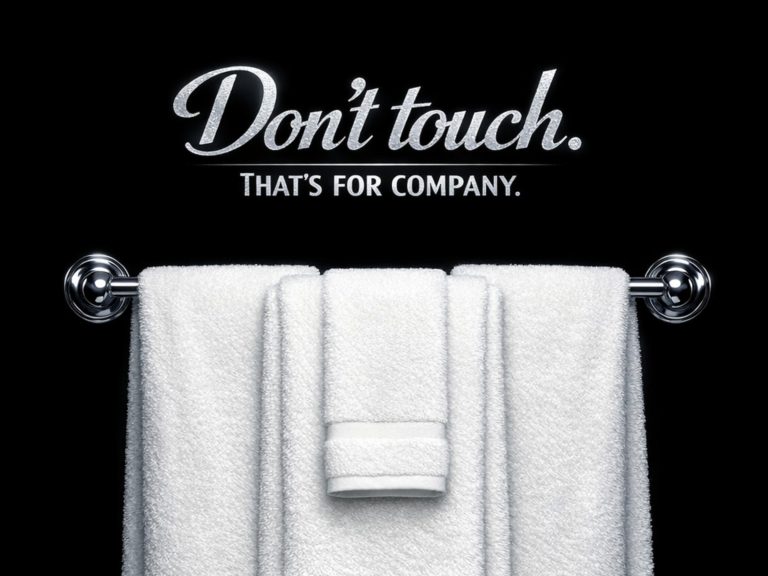 White towel hanging on a towel rack with "Don't touch" sign, black background, for luxury hotel or s.