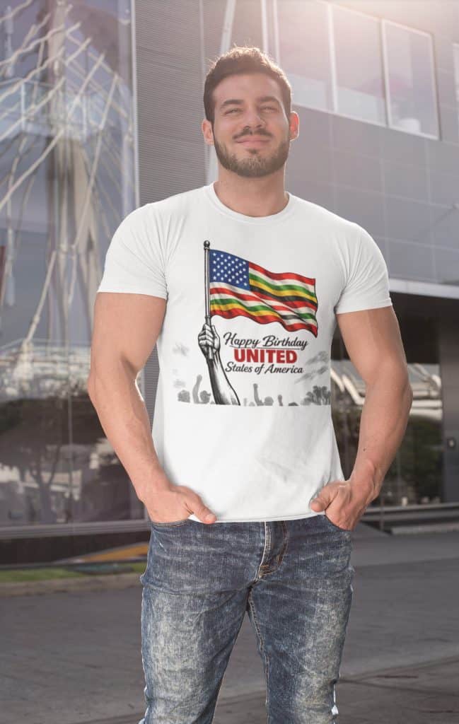Young man wearing a "Happy Birthday United States of America" T-shirt with American flag design outd.